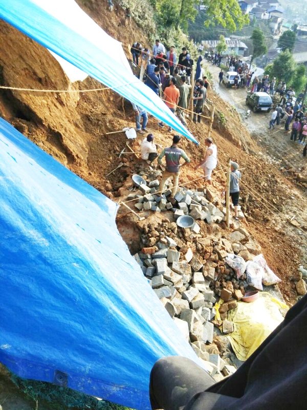 Volunteers making efforts to dig out victims buried under landslide debris in Mokokchung town on Saturday.