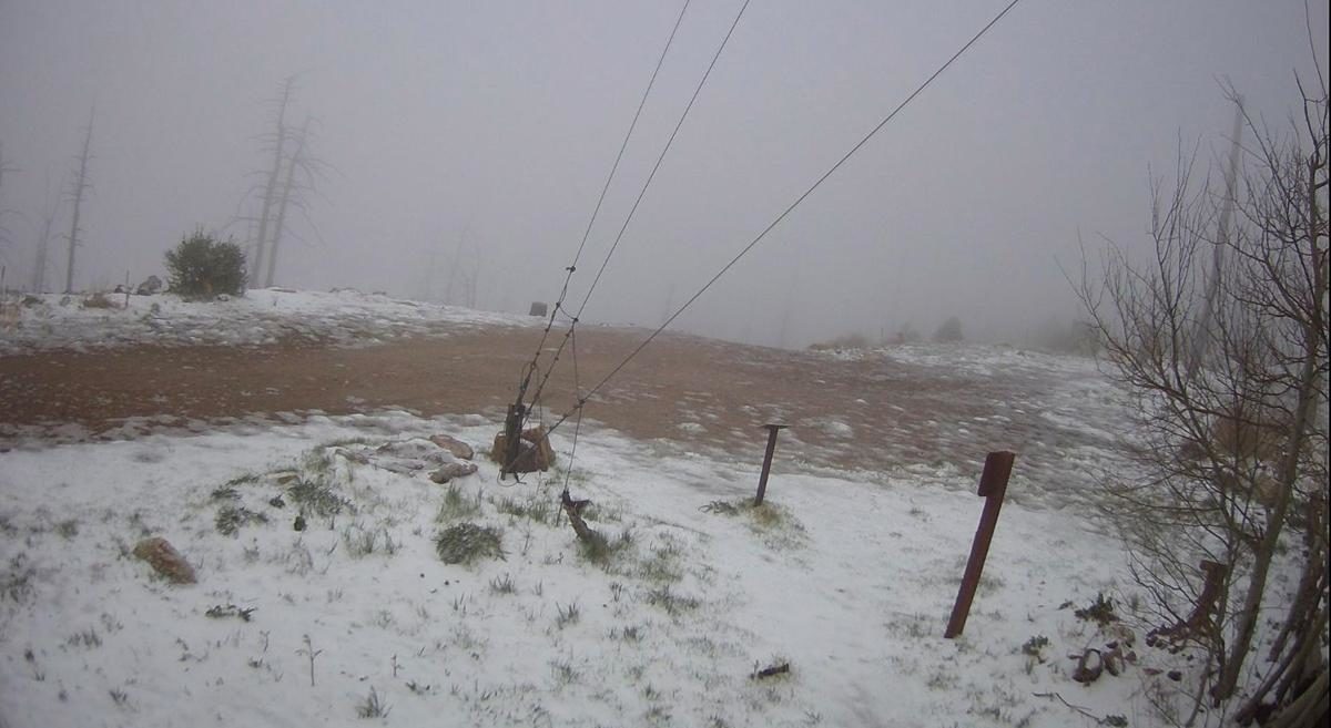 A webcam posted on Mount Lemmon shows Tuesday night's snowfall.
