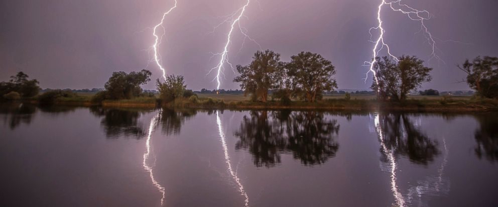 In this May 27, 2018 photo thunderbolts are reflected near Premnitz, eastern Germany.