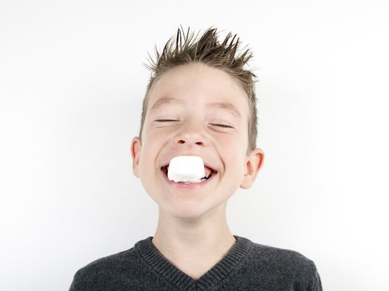 kid eating marshmallow