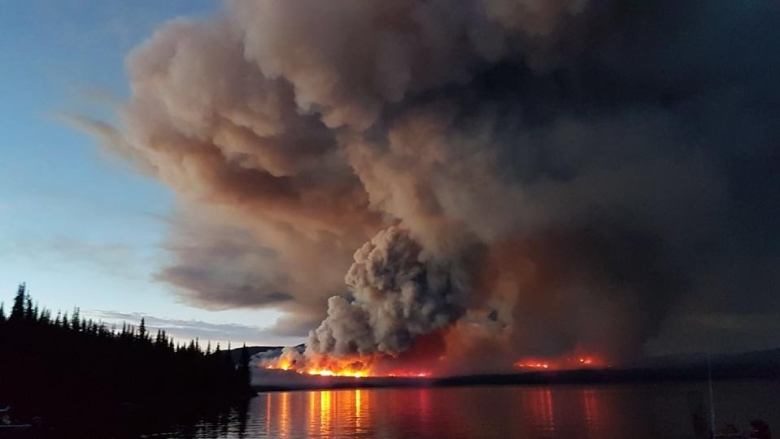 A wildfire burns on Eutsuk Lake in North Tweedsmuir Park south of Houston.