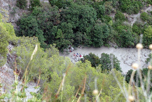Rescuers work at the Raganello Gorge