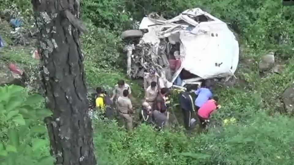 Police, locals and rescue personnel at the site of the mishap