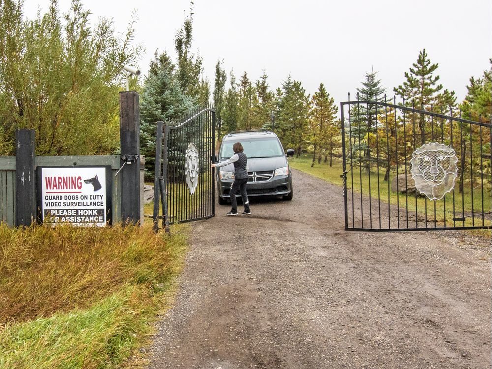 Click to enlarge A vehicle leaves a rural property on Sunday