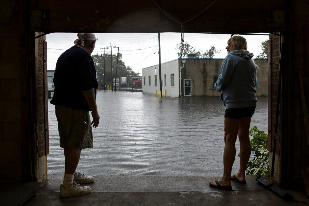 Click to enlarge Carl Mancini, left, and Carol Miller look out