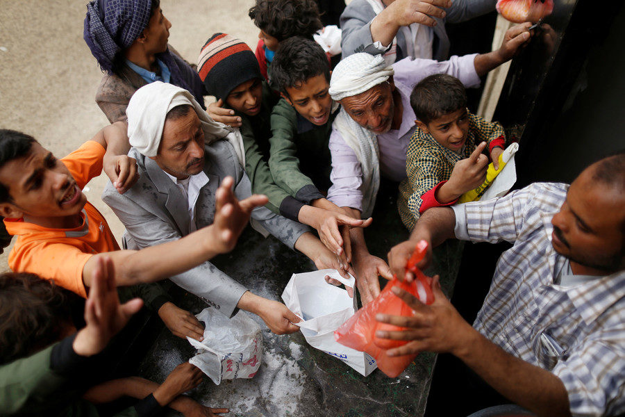 People gather to collect food rations