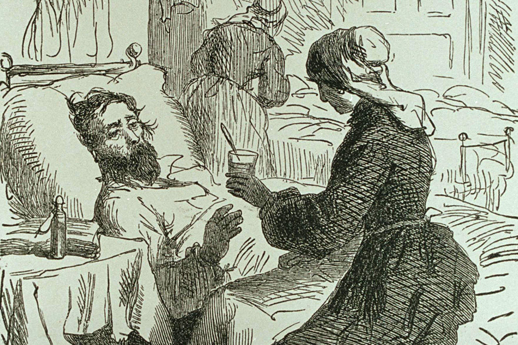 A woman tending to a sick man
