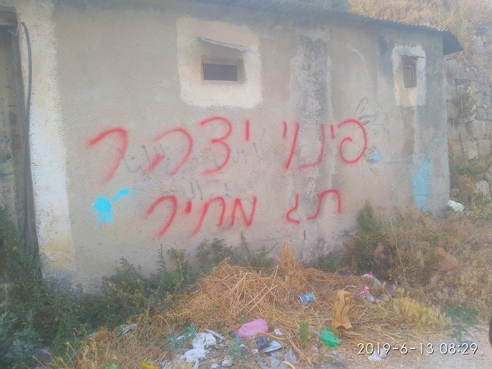 illegal settlers grafitti