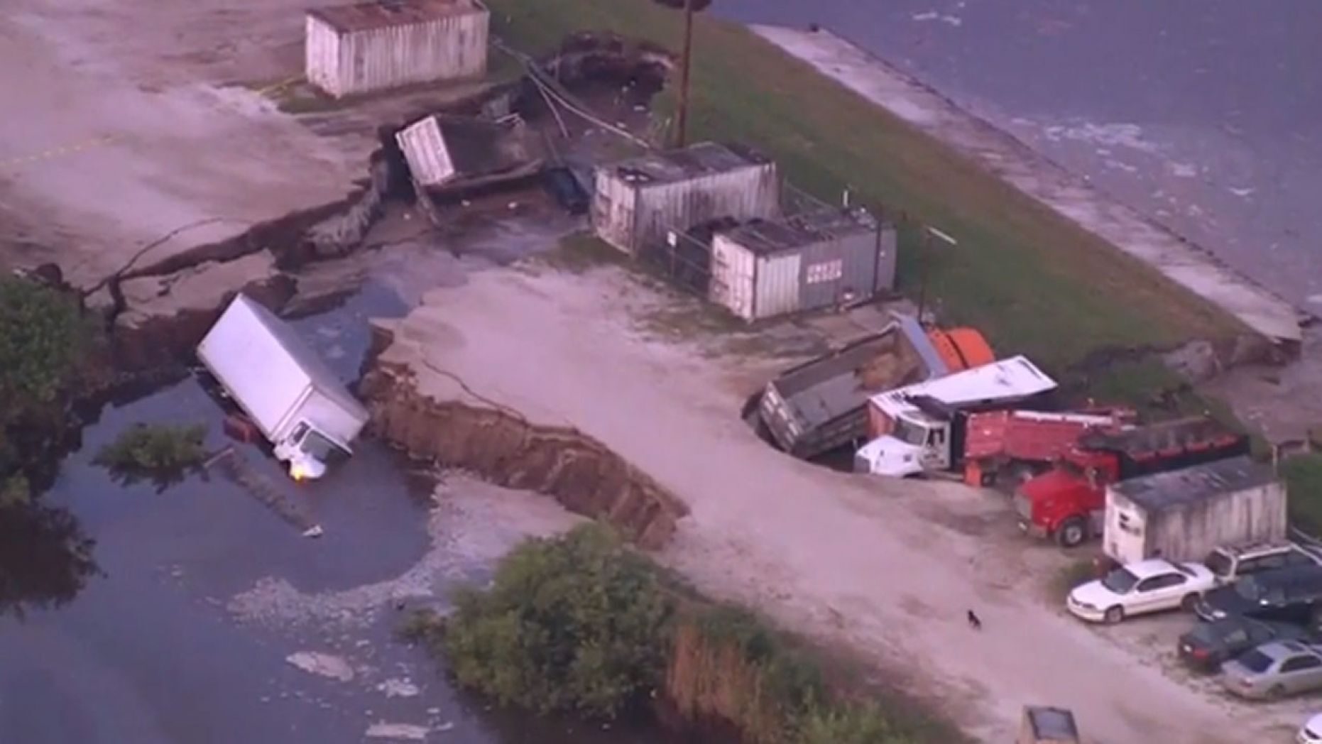Click to enlarge Several trucks ended up in a possible sinkhole near Orlando International Airport early Wednesday.