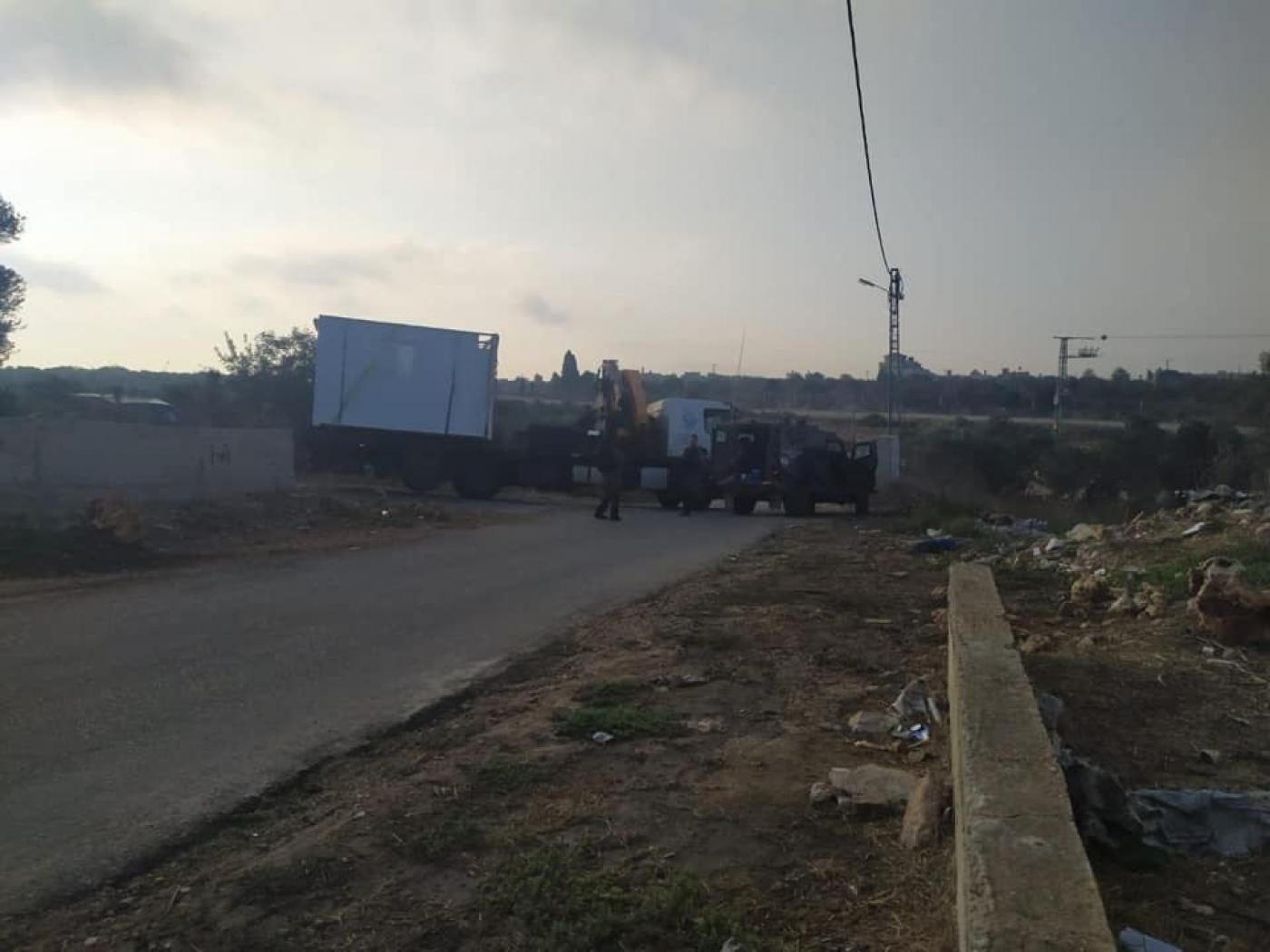 Israeli forces confiscate a mobile container