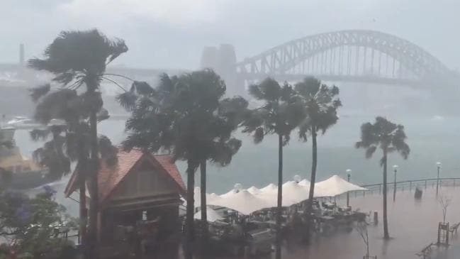 The storm sweeps across Circular Quay and Sydney Harbour