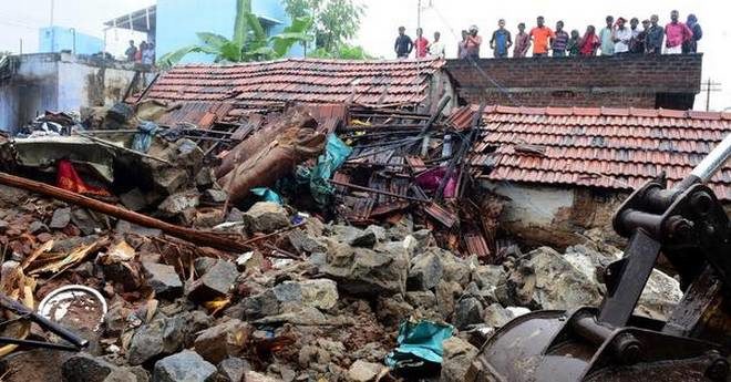 The wall collapsed on houses, killing 17 people in Nadur in Mettupalayam