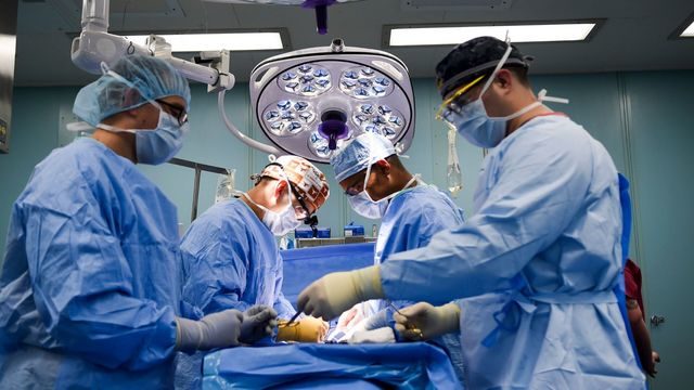 surgeons operate
