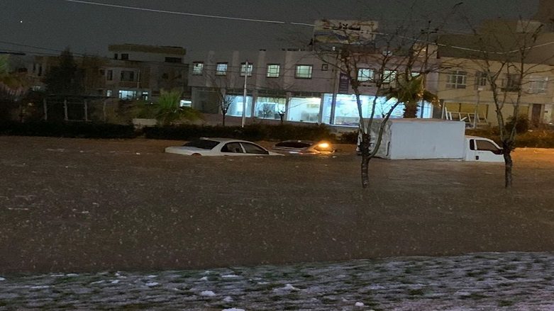 Cars stuck on the street during flash floods in Duhok city, March 18, 2020.
