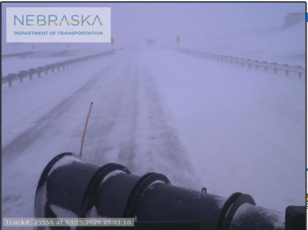 A plow truck attempting to clear a highway in Nebraska covered with snow on Thursday afternoon.