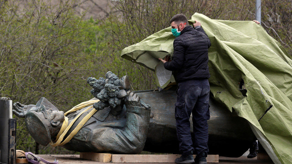 worker covers the statue of Ivan Konev