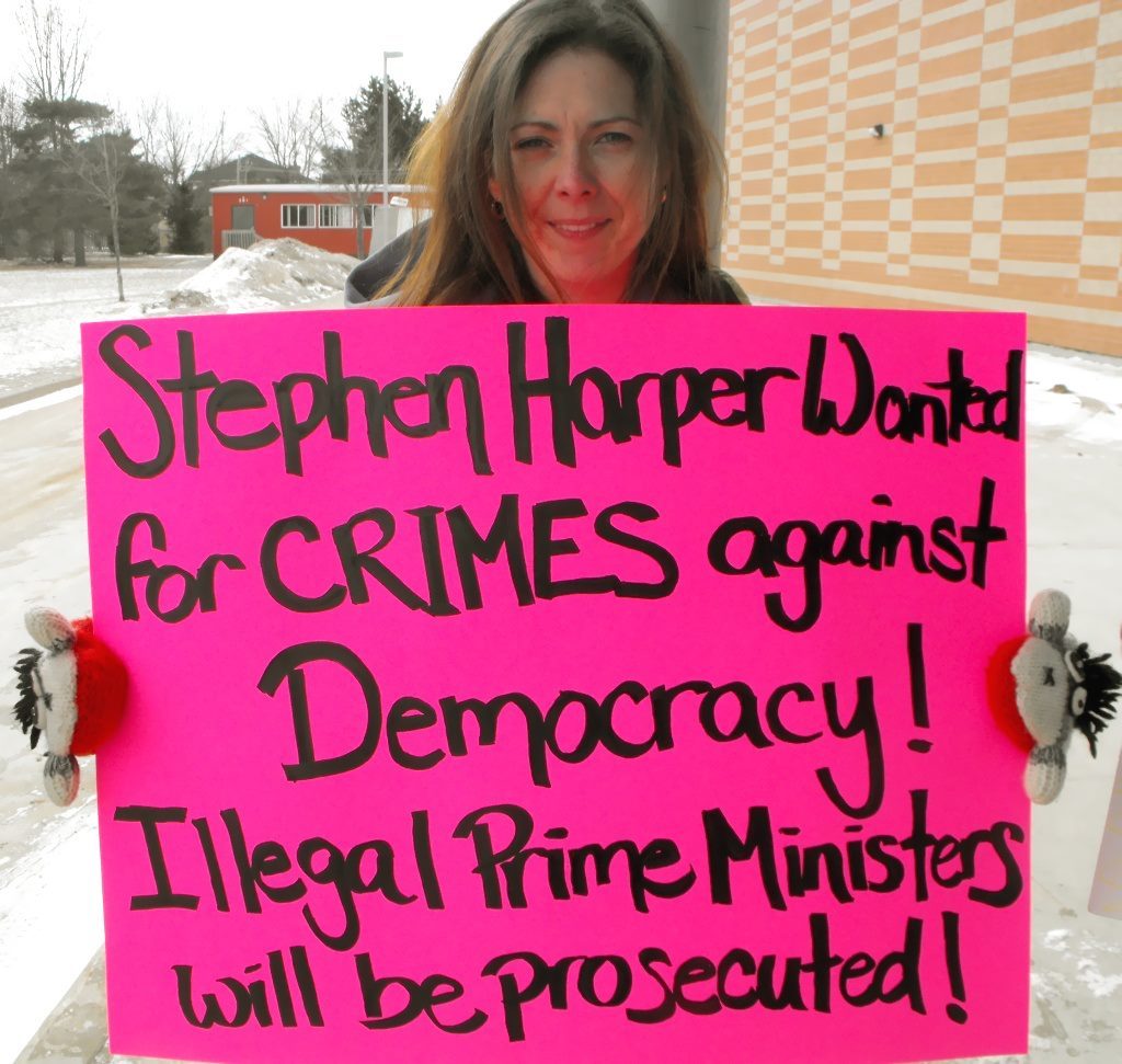 MacPherson has been a fierce Liberal Party stalwart for many years. She is pictured above protesting outside of an event being held by Stephen Harper in 2012.