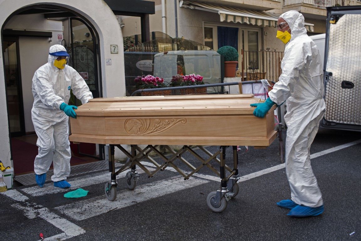 coronavirus deaths coffin PPE