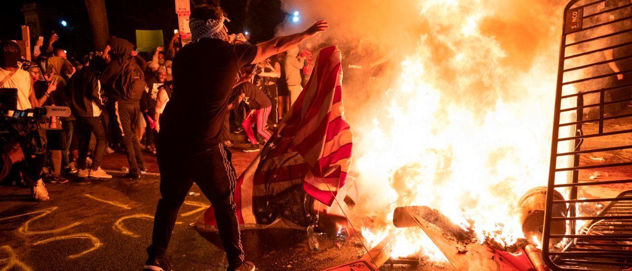 george floyd riots burning flag