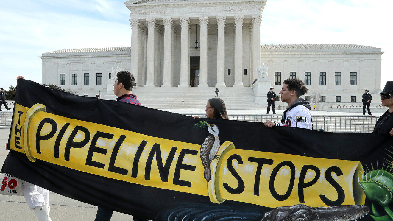 Climate activist groups protest outside U.S. Supreme Court