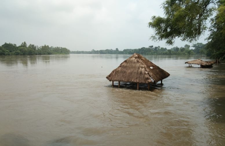 River water flowing above the danger mark inundating large swathe of land during the second phase of flood in Dinajpur