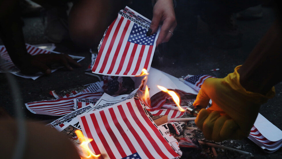 protesters burn flags and flag leaflets