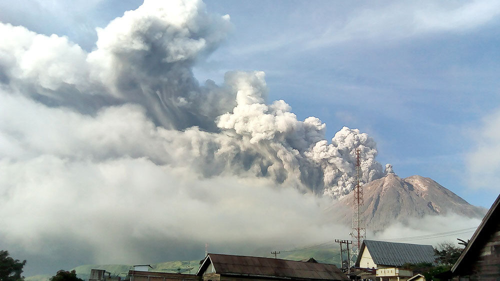 Thick smoke billows up from Mount Sinabung