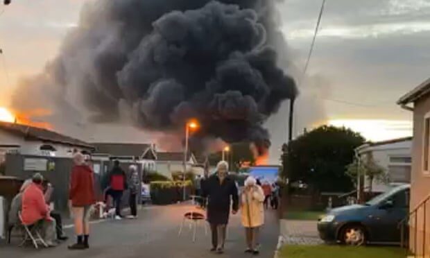 Smoke pours from the fire at an industrial building in Kent