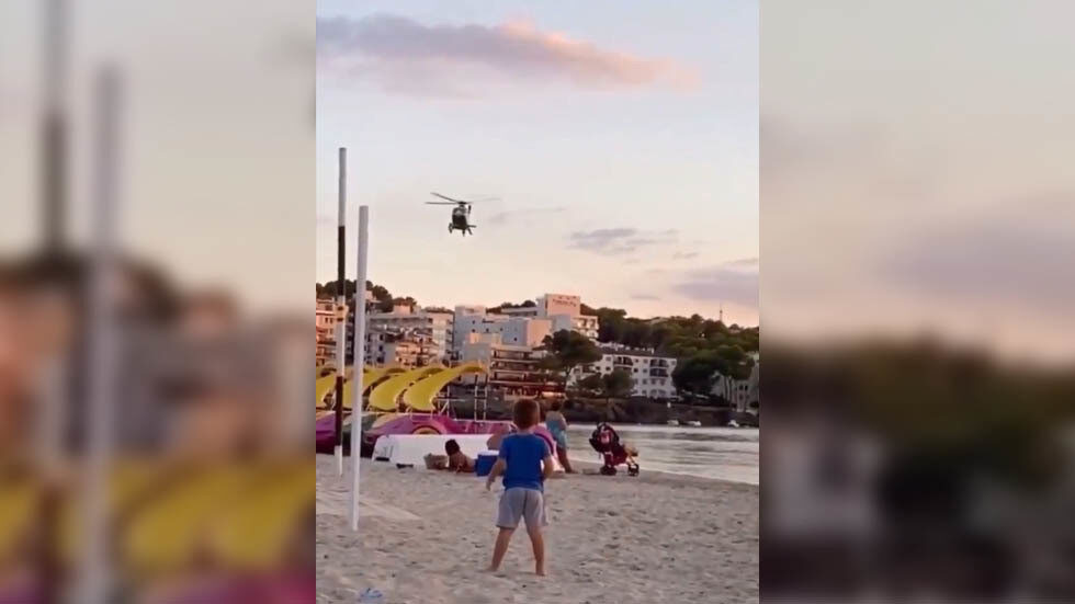 masks social distance spain beach helicopter