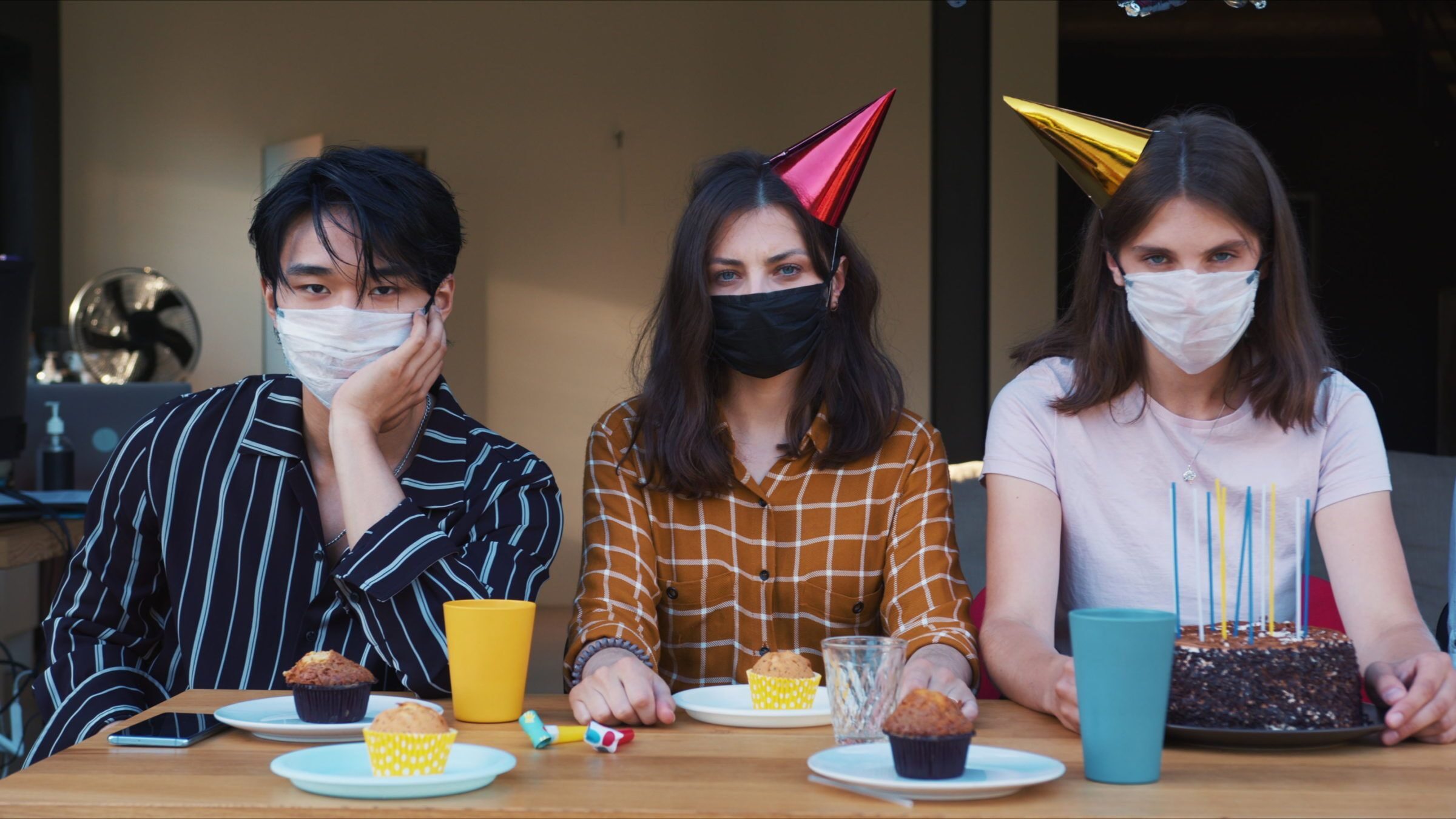 students wearing mask at party