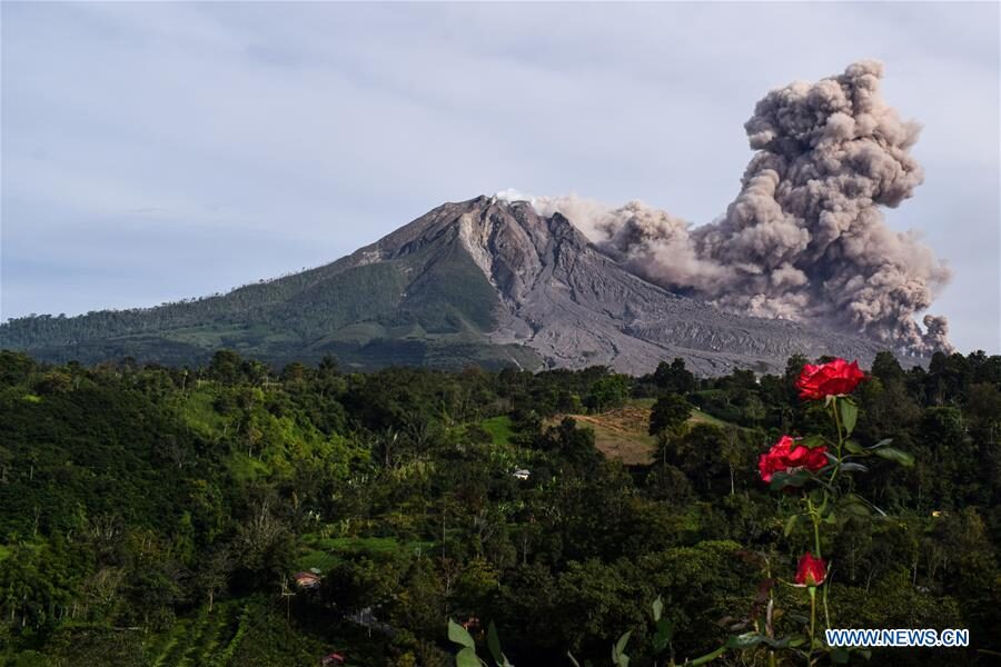 Photo taken on Oct. 29, 2020 shows Mount Sinabung spewing volcanic materials at Tiga Pancur village in Karo, North Sumatra, Indonesia.