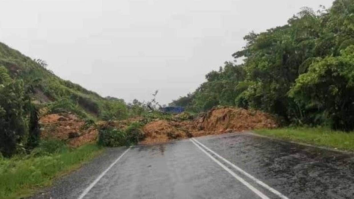 Click to enlarge Bad weather from the approaching cyclone caused a landslide at Viwa on Thursday.