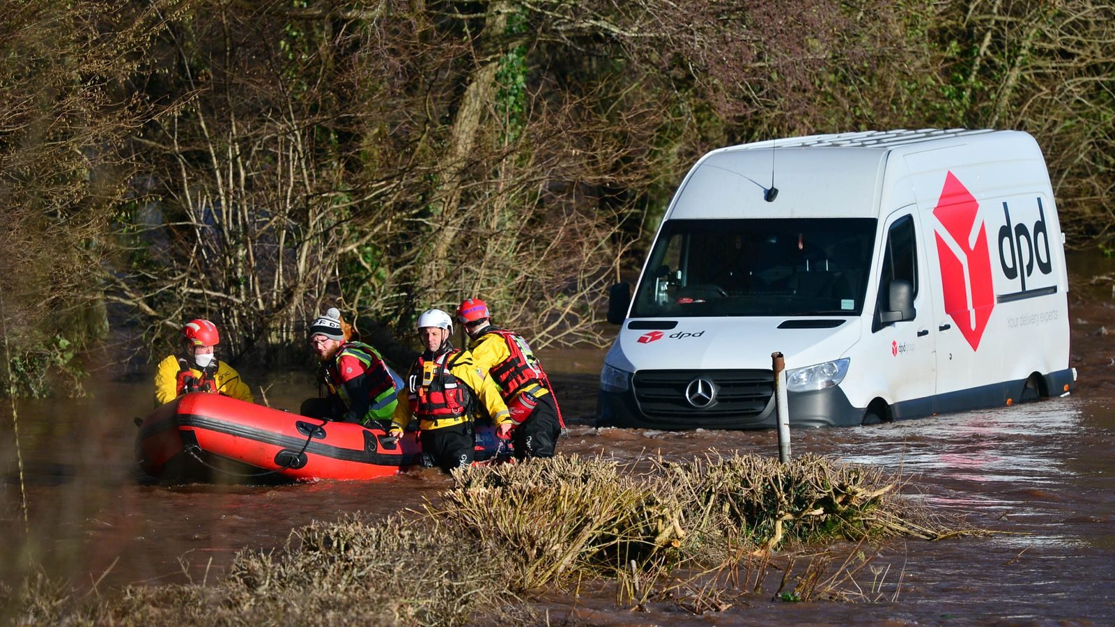 Emergency services rescued a delivery van driver stranded in flood water in Newbridge on Usk, Wales