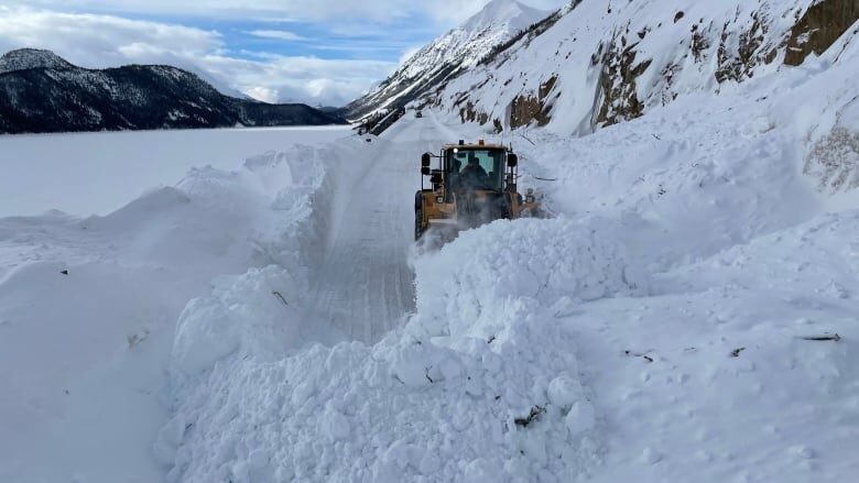 A snowplow clears a path on the South Klondike Highway. On Tuesday, the highway was shut down.