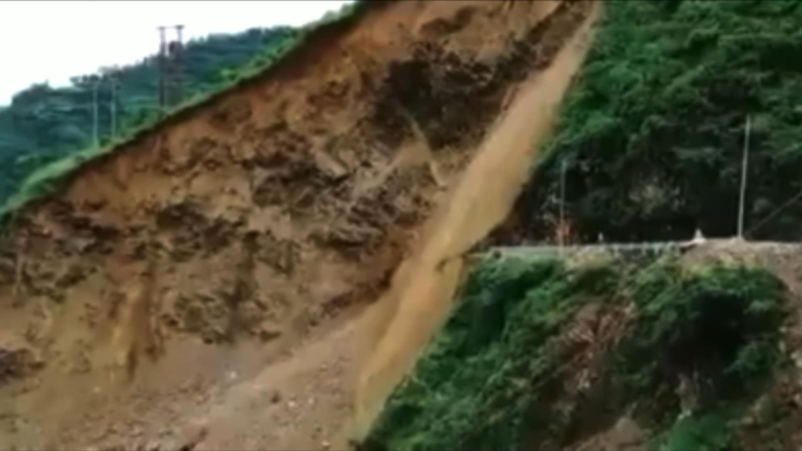 A stretch of road collapses due to a landslide in the Sirmaur district in Himachal Pradesh, India.