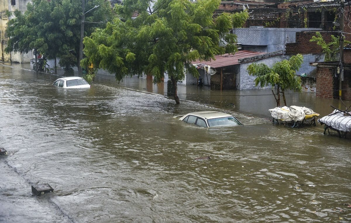 Partially submerged vehicles due to waterlogging following heavy rains in Lucknow, Thursday, Sept. 16, 2021.