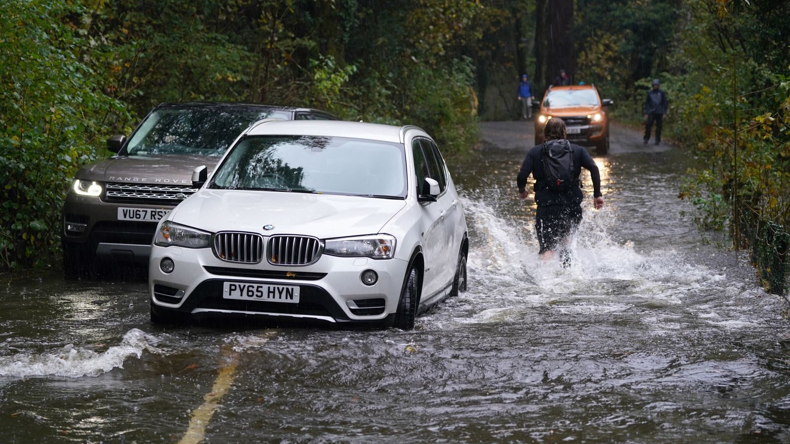 A broken-down car in floodwater near Derwentwater