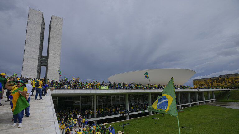 Click to enlarge Supporters of Brazil's former President Jair Bolsonaro storm the the National Congress building in Brasilia, Brazil,