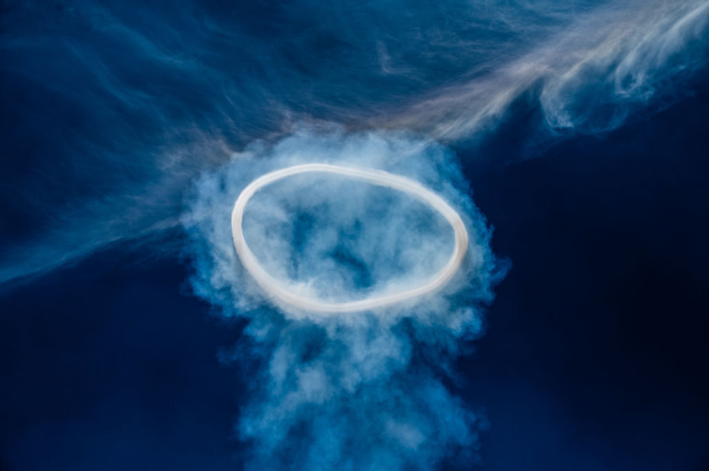 Smoke rings, composed of a mixture of smoke, steam and other gases are expelled at high speed, as the rarely seen weird phenomenon appears above above Etna before it erupts.