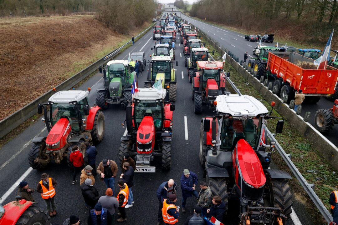 French farmers use their tractors to block the A1 highway