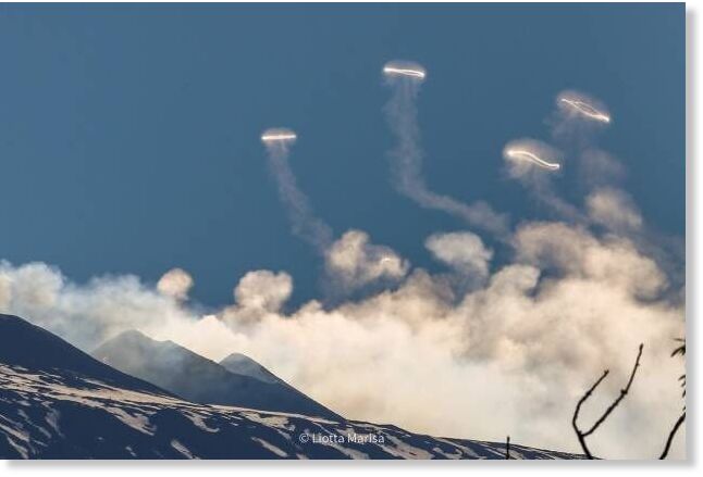 Smoke rings over Mt. Etna, Sicily, Italy,