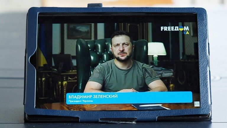 FILE PHOTO: A tablet showing an address by Ukrainian President Vladimir Zelensky on national television.