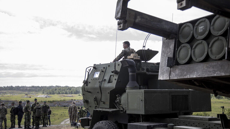 Click to enlarge US service member on a HIMARS at the Baltops 24