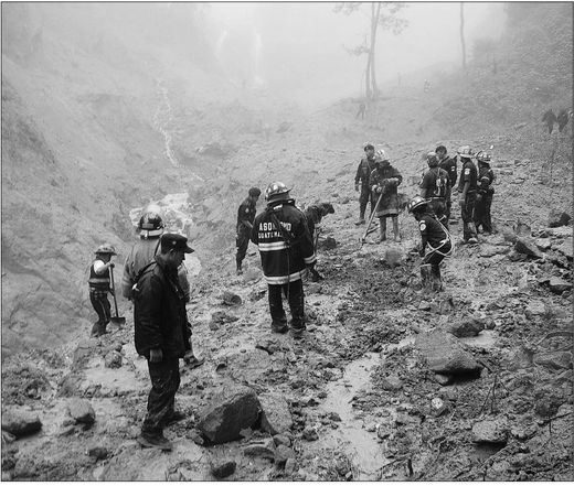 Click to enlarge search for victims of a landslide 170 kilometres west of Guatemala City