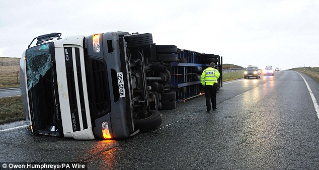 UK storm overturned lorry