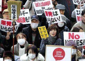 People with “No Nukes” signs march, Tokyo