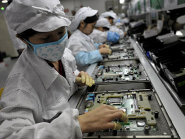 Chinese workers assemble electronic components