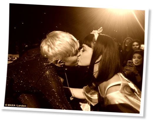 katy perry and miley cyrus share a kiss