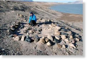Click to enlarge Astrid Lyså in August 2007 in the ruined settlement left by the Independence I Culture in North Greenland