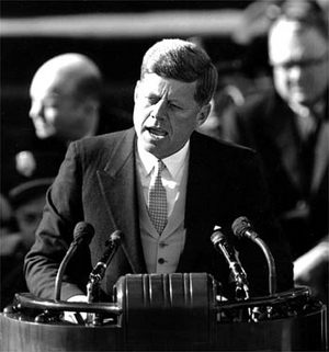JFK speaking at podium
